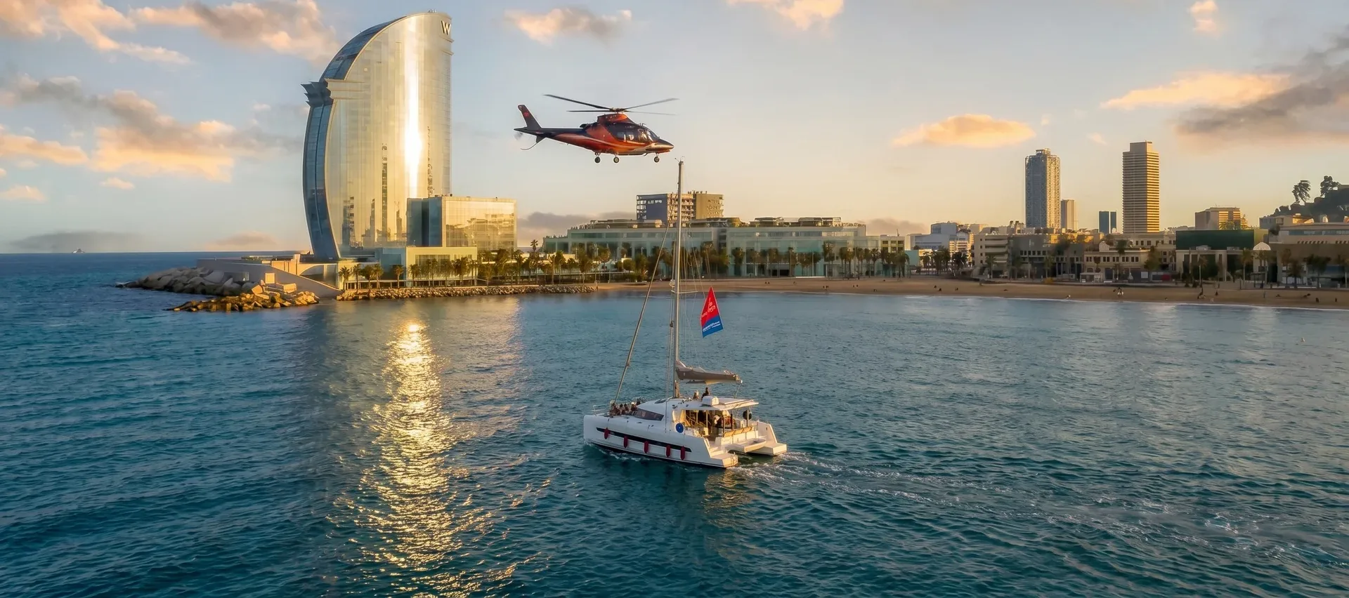 Helicopter and catamaran at sunset in Barcelona